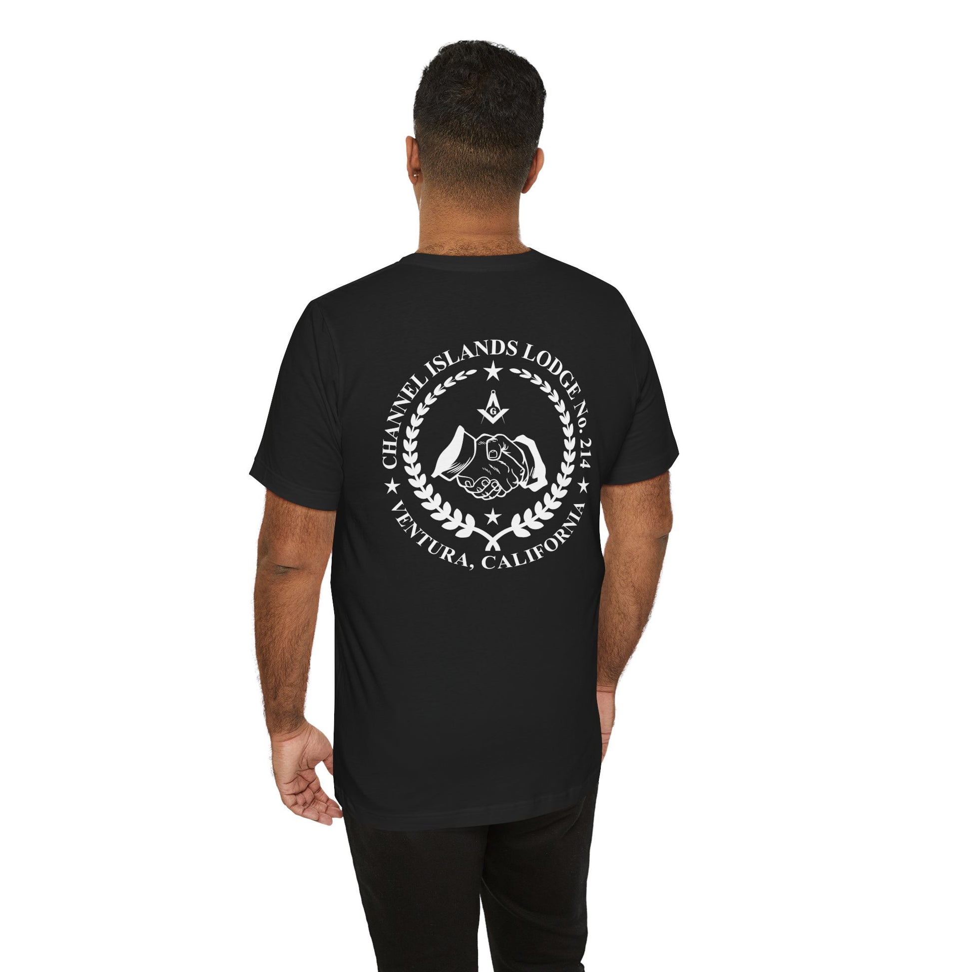 Dark-colored Entered Apprentice T-shirt with Channel Islands Lodge 214 logo, displayed on a flat surface with folded fabric.