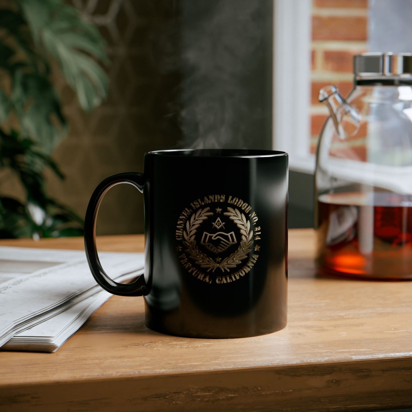 Black coffee mug featuring a 3D gold, 2-sided Channel Islands Lodge emblem, available in 11oz and 15oz sizes.