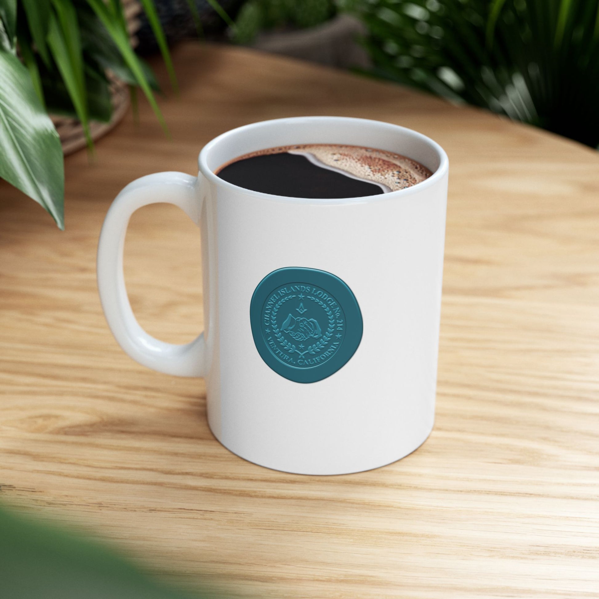 White ceramic mug featuring two-sided custom wax seal design with Channel Islands Lodge logo, 11oz or 15oz capacity.